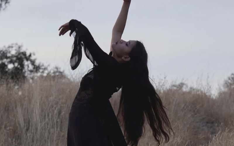 Woman expressing freedom and embodiment through movement
